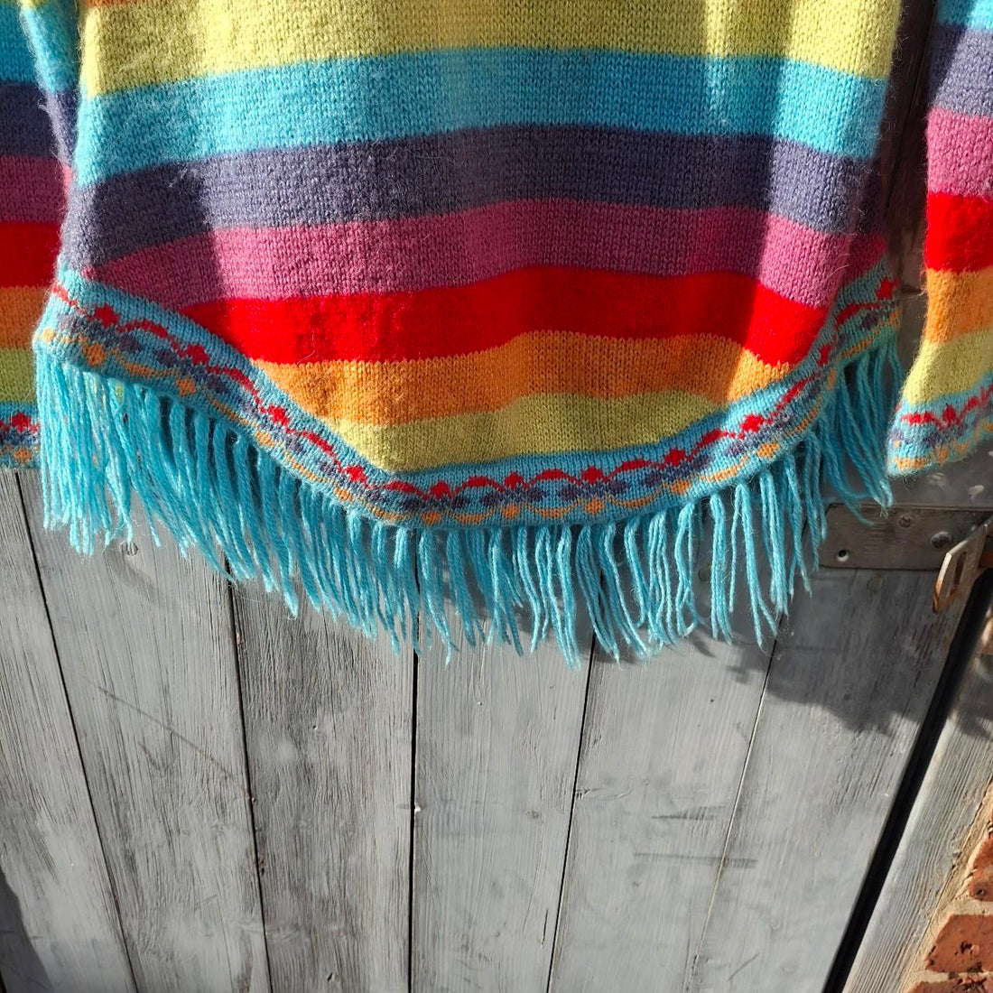 Colourful Multi-Coloured Rainbow Alpaca Wool Poncho With Fringed Hem. - Festigal
