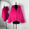 Hot pink fur coat on a mannequin against a white background
